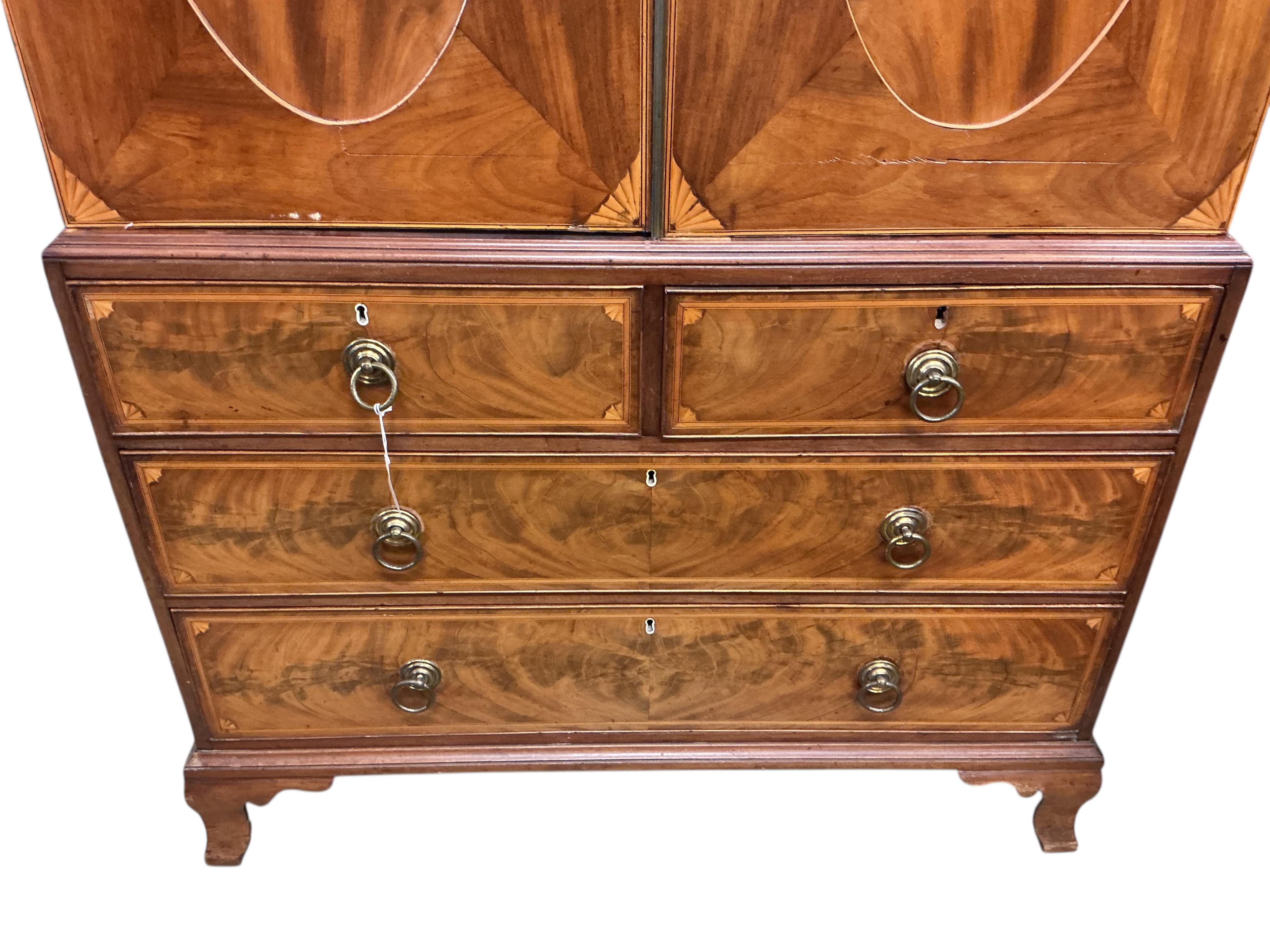 A George IV marquetry inlaid mahogany linen press, width 124cm, depth 60cm, height 223cm